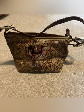 Gold Patterned Mini Wristlet Bag with Artistic Motif
